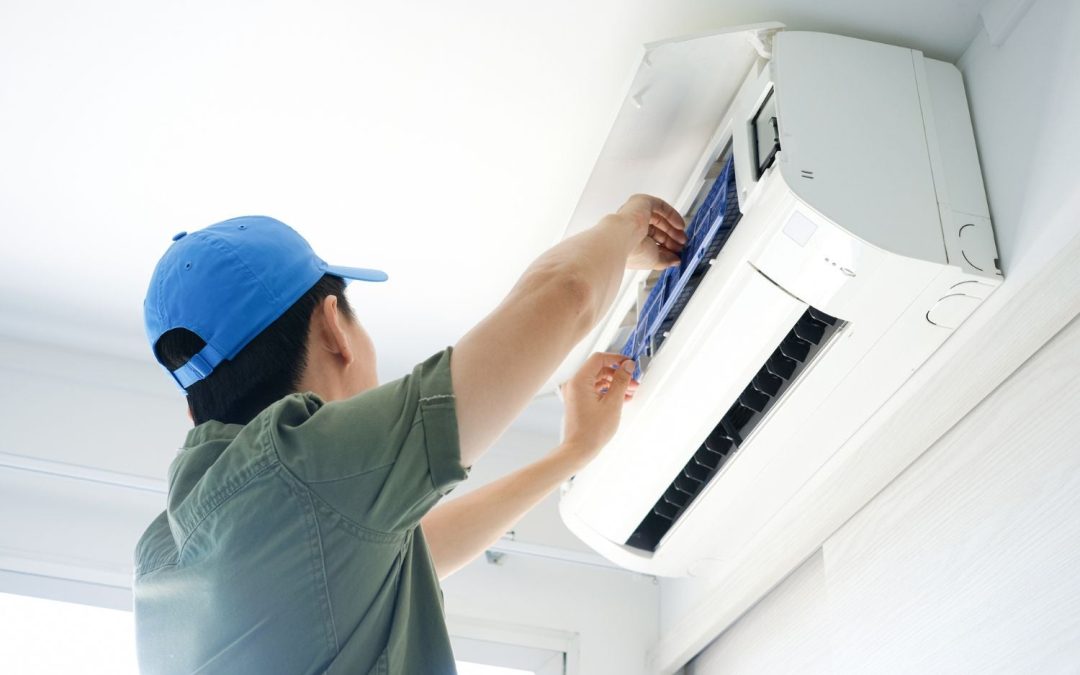 HVAC technician servicing a ductless mini split in San Juan Capistrano