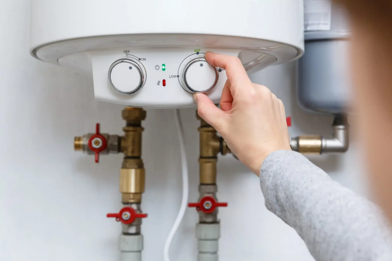 Technician adjusting a water heater in San Juan Capistrano